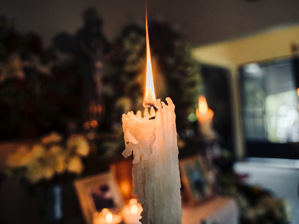 white candle in a room