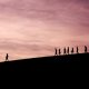 silhouette of people on hill