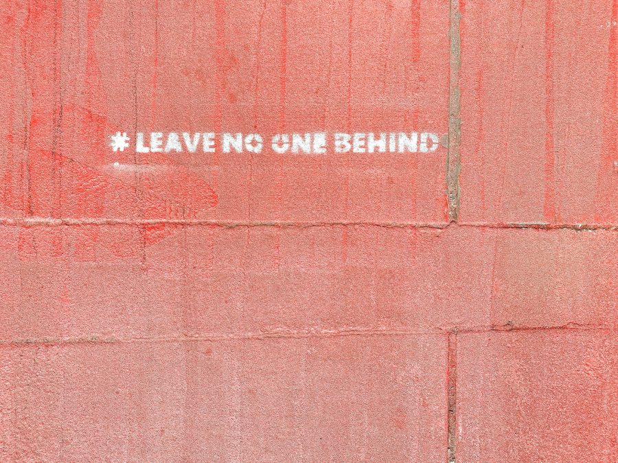 a red wall with a white sticker on it